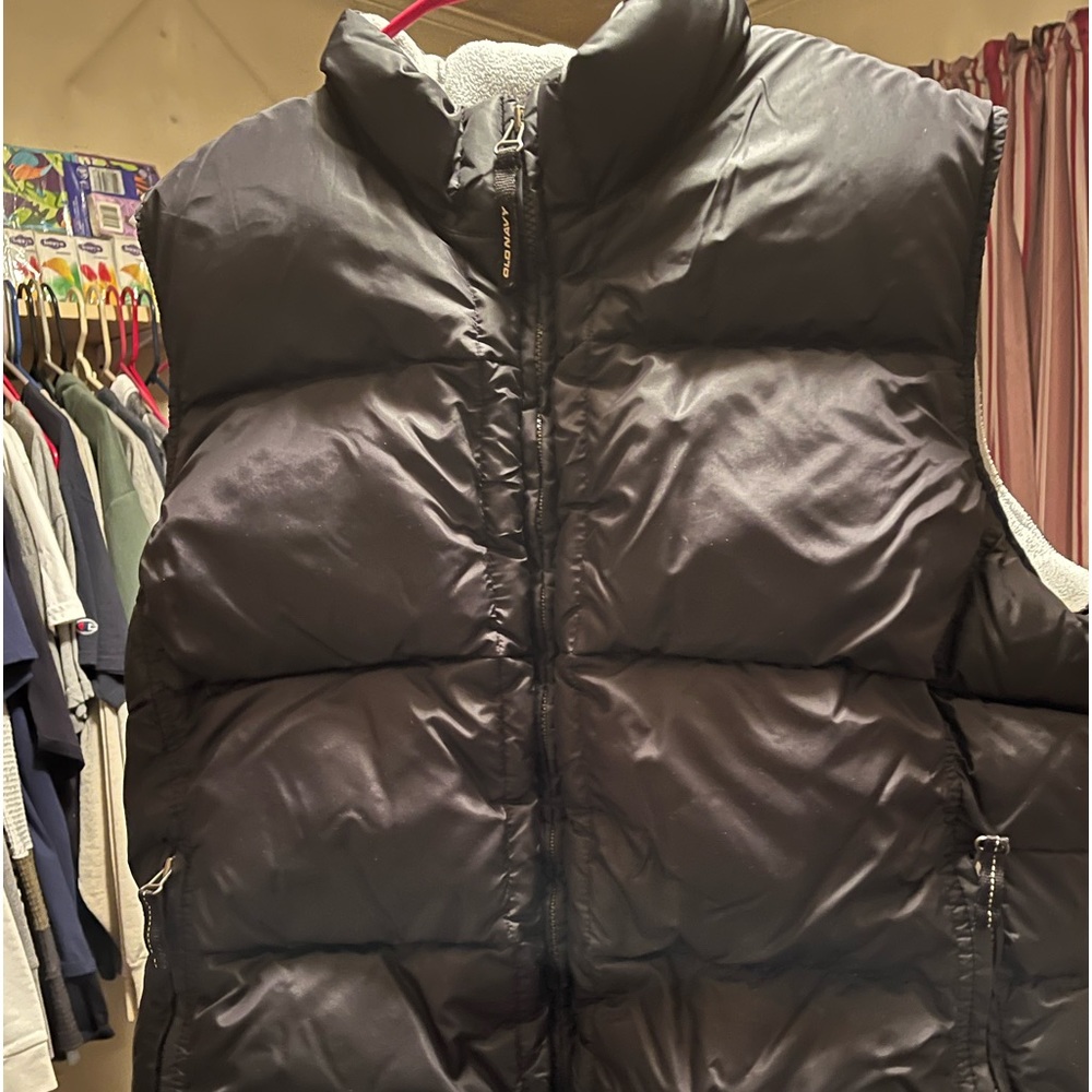 Puffy black sleeveless vest! Very warm and comfortable! Light blue lining.